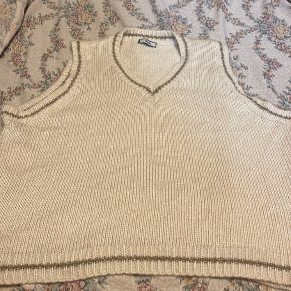 Super fuzzy and soft knit sweater vest.